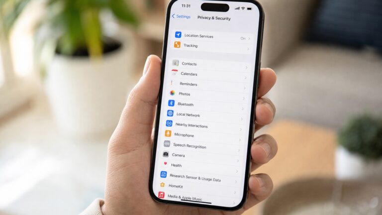 iPhone exibindo tela de Ajustes de Privacidade e Segurança do iOS 27